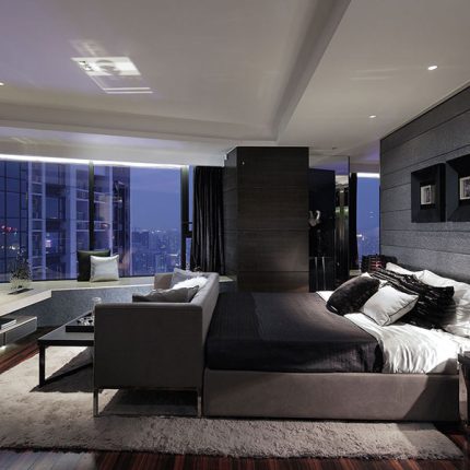 A living room with a large window and a couch