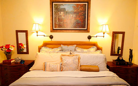 A bed with pillows and blankets on it