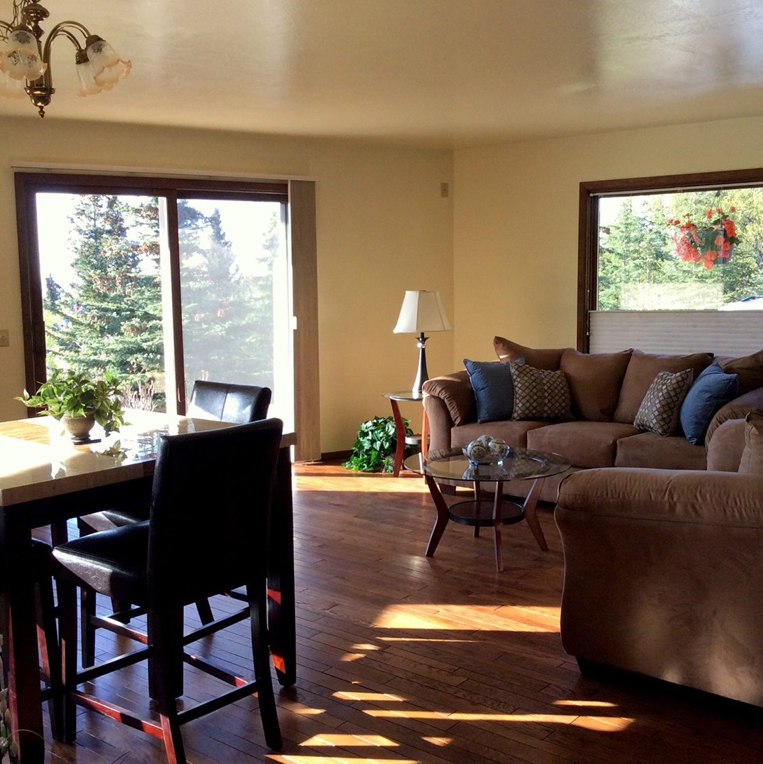 A living room with couches and tables in it