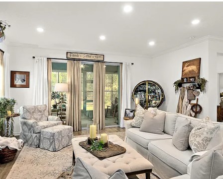 A living room with couches and chairs in it